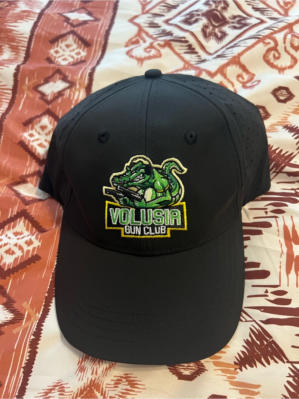 Black Volusia Gun Club Hat with Green Crocodile Logo